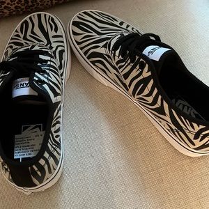 Size 8. New without box.  Shimmering zebra pattern Vans sneakers